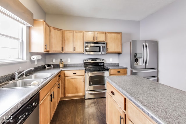 kitchen with sink, dark hardwood / wood-style flooring, light brown cabinetry, and appliances with stainless steel finishes