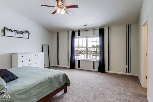 carpeted bedroom featuring lofted ceiling and ceiling fan