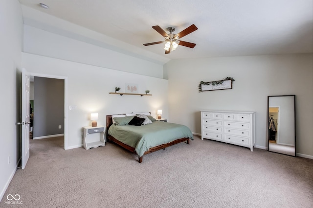 bedroom with light carpet, ceiling fan, and vaulted ceiling