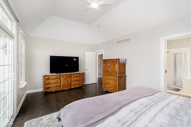 bedroom featuring dark wood-type flooring, a raised ceiling, ceiling fan, and connected bathroom