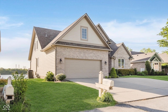 3150 Beach Blvd, Cicero, IN 46034 - view of front facade featuring concrete driveway, a front yard, brick siding, and a shingled roof