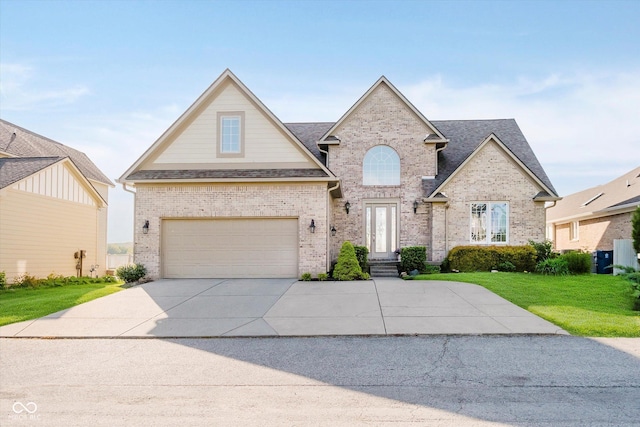 3150 Beach Blvd, Cicero, IN 46034 - traditional home with a front yard, brick siding, an attached garage, concrete driveway, and roof with shingles