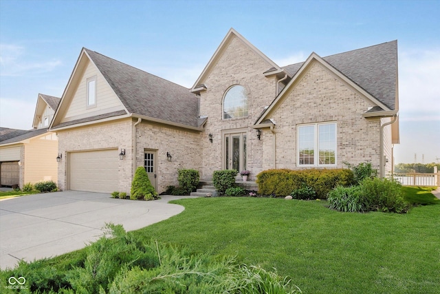 3150 Beach Blvd, Cicero, IN 46034 - traditional-style house featuring brick siding, roof with shingles, a front lawn, and driveway