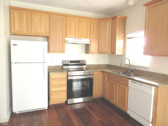 kitchen with dark hardwood / wood-style flooring, sink, and white appliances