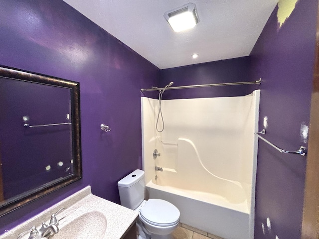 full bathroom with toilet, vanity, tile patterned floors, and shower / washtub combination