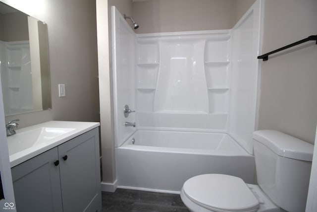 full bathroom with vanity, shower / bathing tub combination, wood-type flooring, and toilet