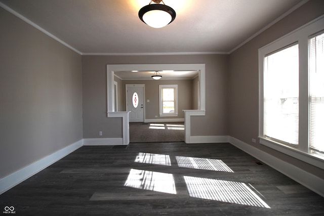 foyer entrance featuring crown molding and dark hardwood / wood-style floors