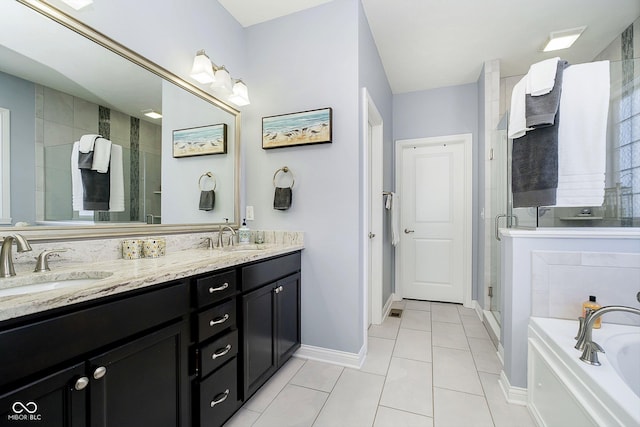 bathroom with tile patterned flooring, vanity, and separate shower and tub