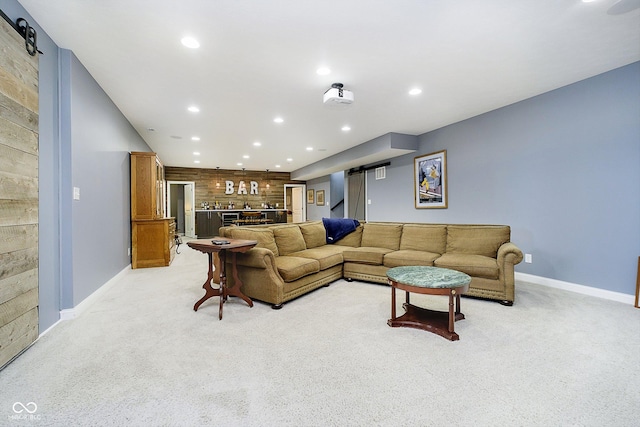 living room featuring light colored carpet and indoor bar