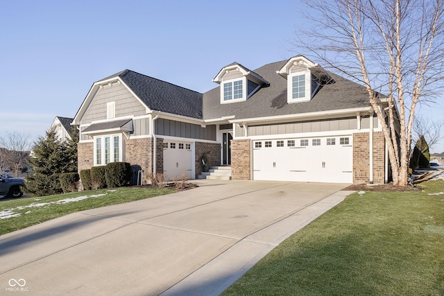 view of front of property with a garage and a front yard