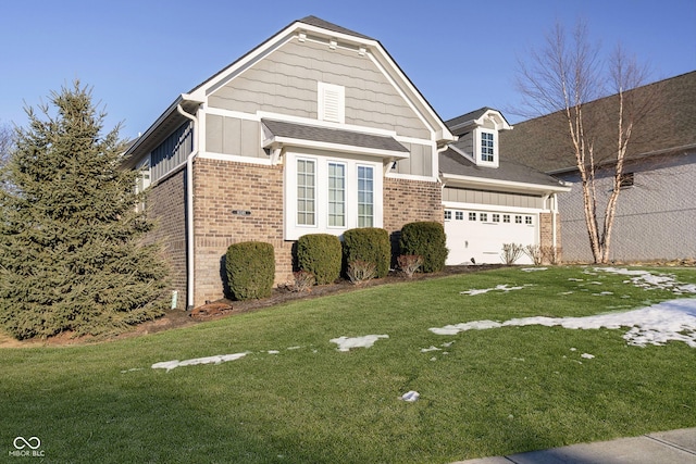 view of front of home featuring a garage and a front yard