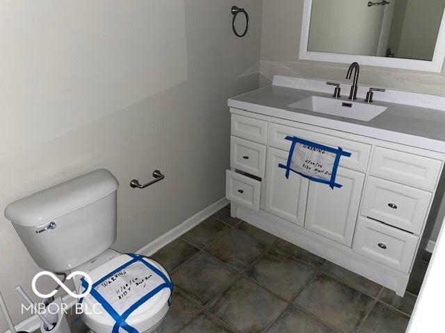 bathroom with vanity and toilet