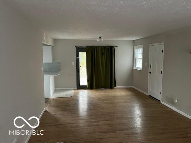 unfurnished living room with hardwood / wood-style floors