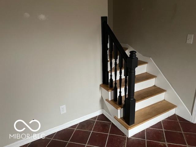 staircase with tile patterned flooring