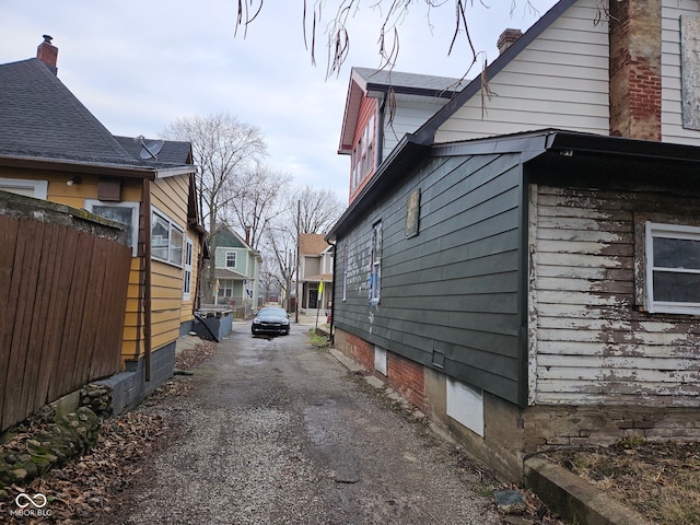 view of home's exterior featuring fence