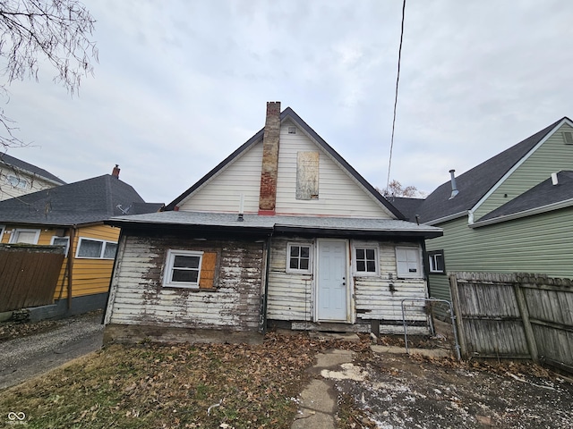 back of property featuring fence