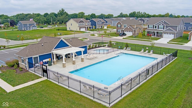 view of swimming pool with a yard and a patio