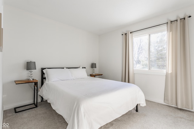 bedroom with light carpet