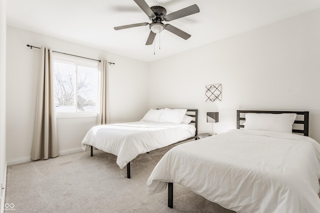 bedroom featuring ceiling fan and light carpet