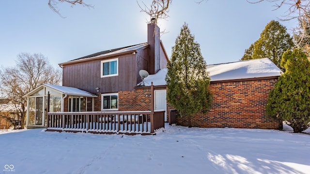 view of snow covered house