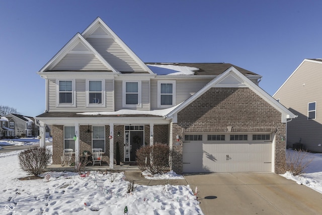 front facade featuring a porch and a garage