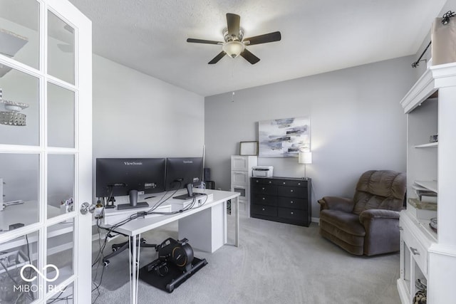 office with ceiling fan and light carpet