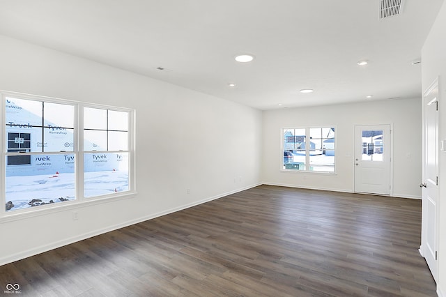 spare room with dark hardwood / wood-style floors