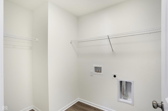 laundry room featuring washer hookup, hardwood / wood-style floors, and hookup for an electric dryer