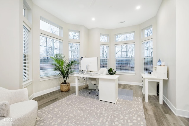 office area with light hardwood / wood-style floors