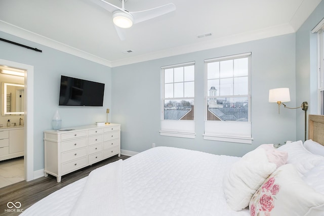 bedroom with ornamental molding, ceiling fan, dark hardwood / wood-style floors, and connected bathroom