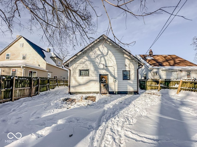 view of snow covered house