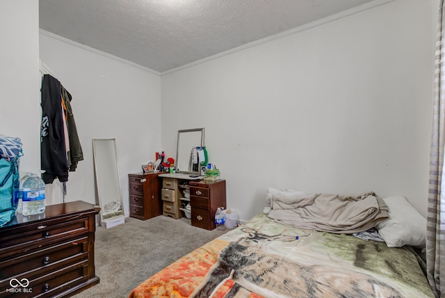 bedroom featuring crown molding, light carpet, and a textured ceiling