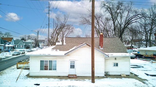 view of snow covered house