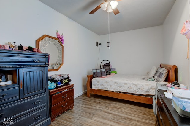 bedroom featuring light hardwood / wood-style flooring and ceiling fan