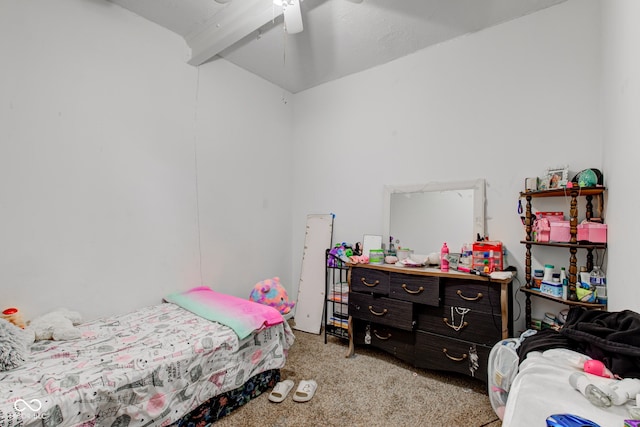 carpeted bedroom with beamed ceiling and ceiling fan