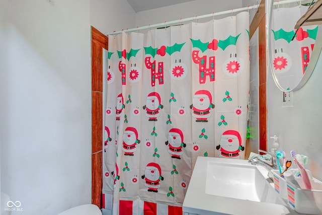 bathroom with vanity, toilet, and a shower with shower curtain