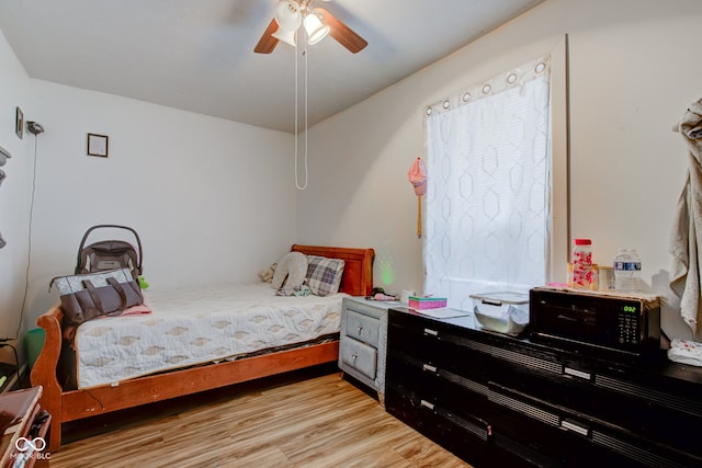 bedroom featuring ceiling fan and light wood-type flooring