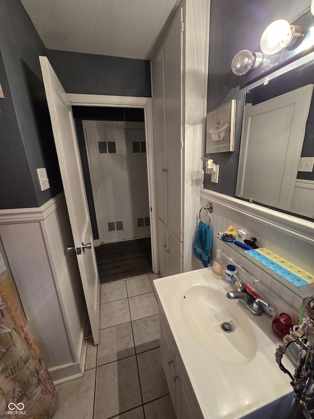 bathroom featuring tile patterned floors and vanity