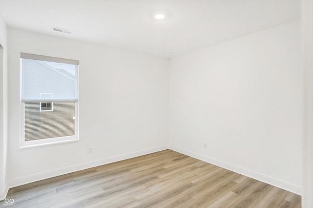 unfurnished room with light hardwood / wood-style floors