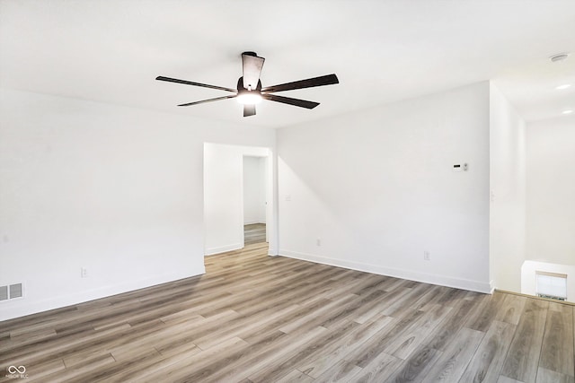 spare room with ceiling fan and light hardwood / wood-style flooring