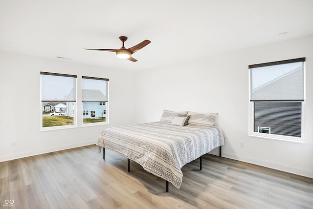 bedroom featuring ceiling fan and light hardwood / wood-style floors