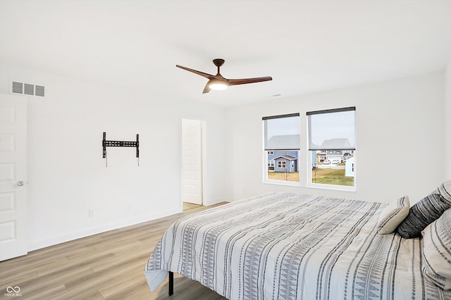 bedroom featuring ceiling fan and hardwood / wood-style floors