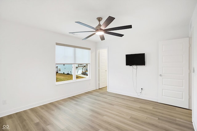 spare room featuring ceiling fan and light wood-type flooring