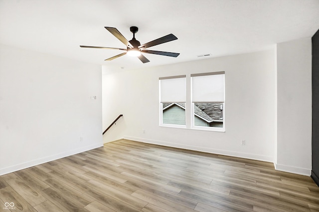 empty room featuring ceiling fan and wood-type flooring