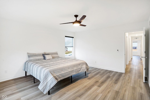 bedroom featuring hardwood / wood-style floors and ceiling fan