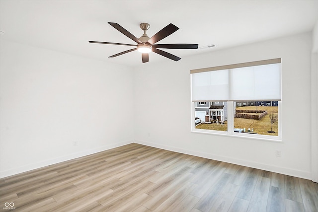 spare room with ceiling fan and light hardwood / wood-style flooring