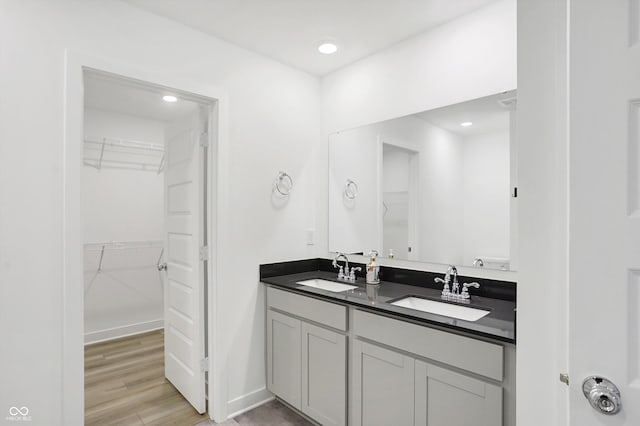 bathroom featuring vanity and hardwood / wood-style floors