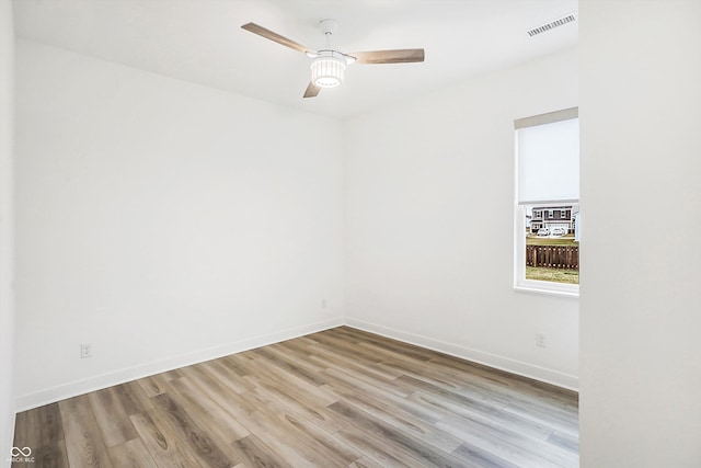 spare room with ceiling fan and light hardwood / wood-style flooring