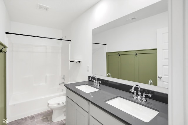 full bathroom with toilet, vanity, tile patterned flooring, and tub / shower combination