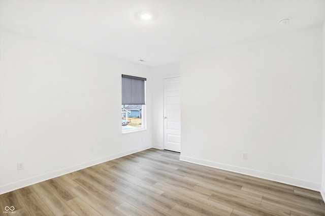 unfurnished room with light hardwood / wood-style floors